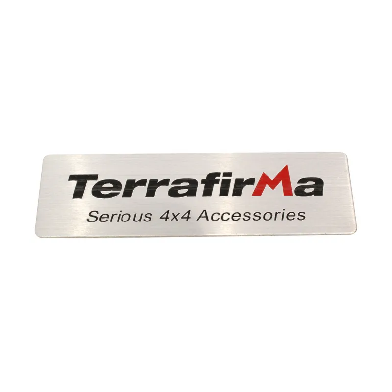 TERRAFIRMA METAL BADGE -SELF ADHESIVE